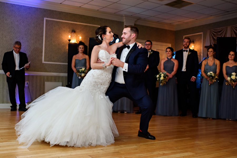 A bride and groom dance their first dance.